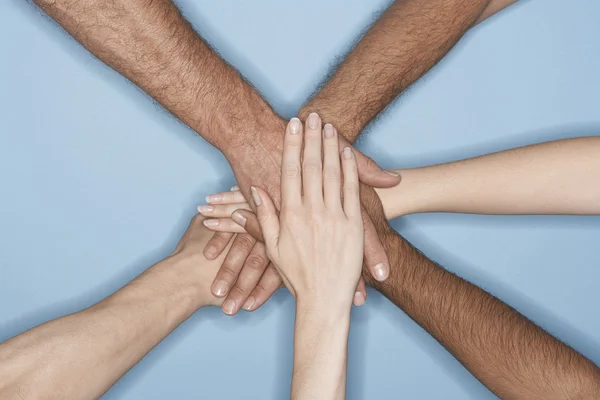 Piling hands on top of each other — Stock Photo, Image