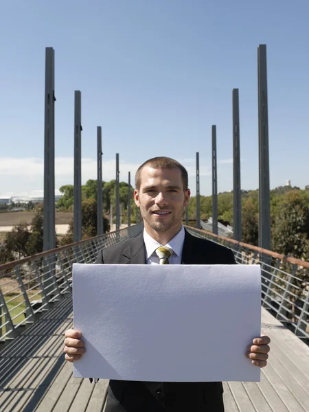 Business man standing on bridge — Stock Photo, Image