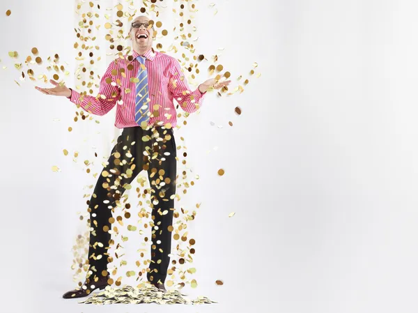 Man laughing with coins falling — Stock Photo, Image