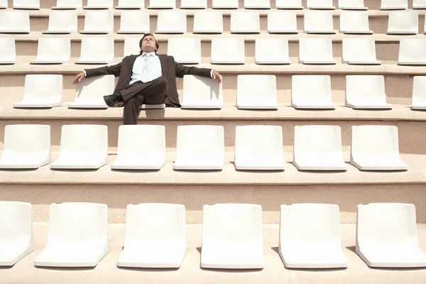 Businessman Relaxing in Auditorium — Stock Photo, Image