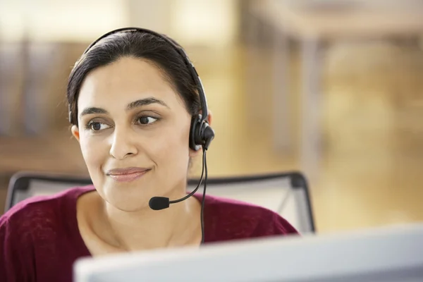 Office worker wearing headset — Stock Photo, Image