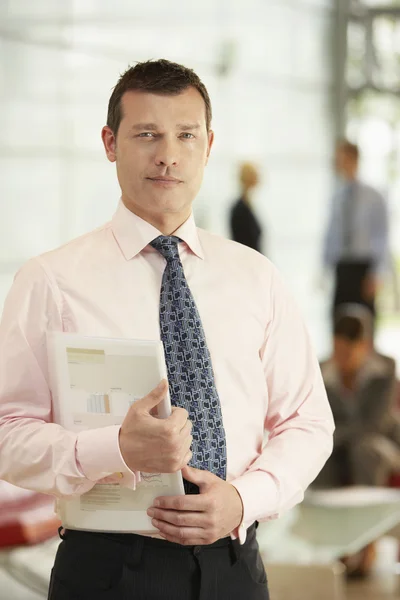 Businessman Holding Report — Stock Photo, Image