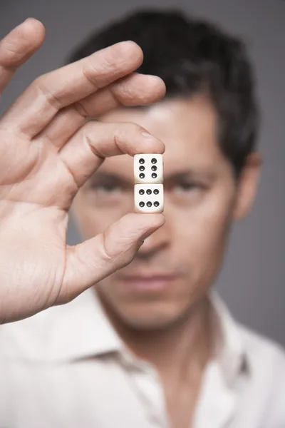 Man holding dice — Stock Photo, Image