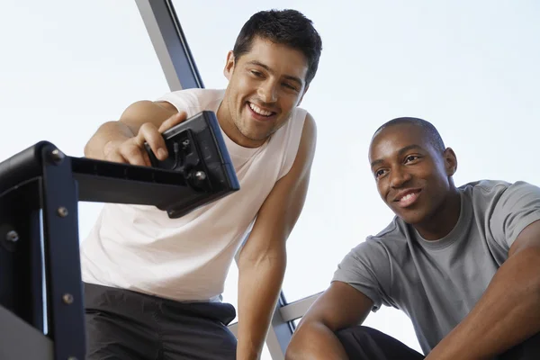 Two men with control panel — Stock Photo, Image