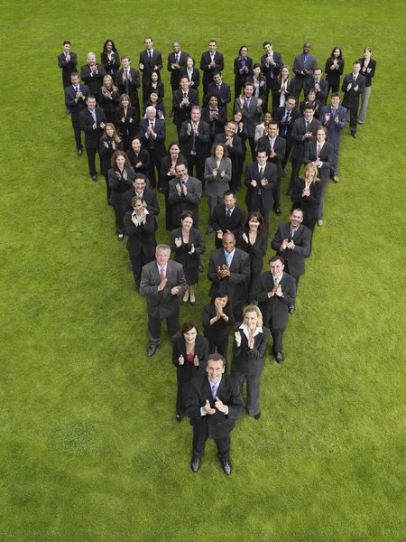 Business people standing in triangle formation — Stock Photo, Image