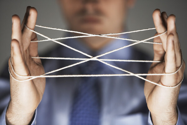 Businessman Playing Cat's Cradle