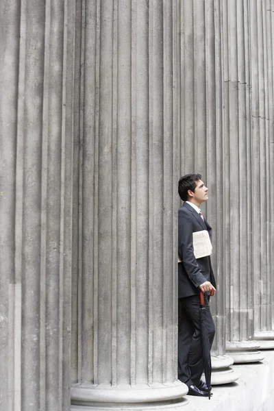 Businessman looking up at sky — Stock Photo, Image