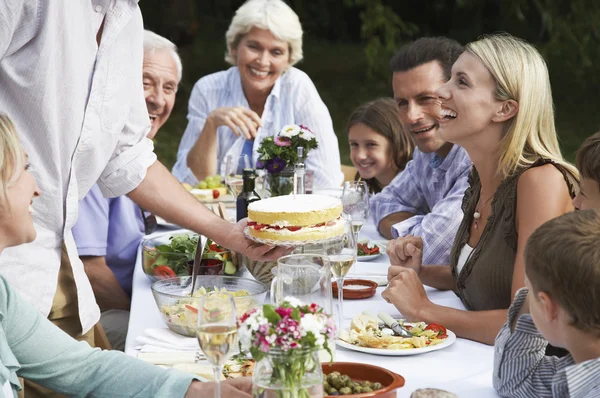 Family dining outdoors — Stock Photo, Image