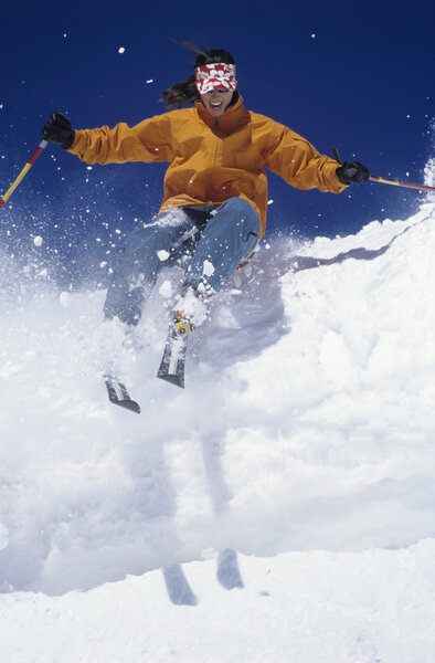 Skier skiing through snow