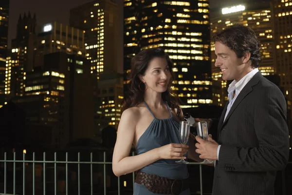 Elegant couple with champagne flutes — Stock Photo, Image