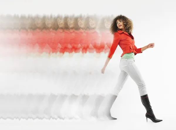 Woman with curly hair walking — Stock Photo, Image