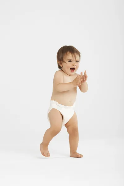 Excited toddler taking first steps — Stock Photo, Image