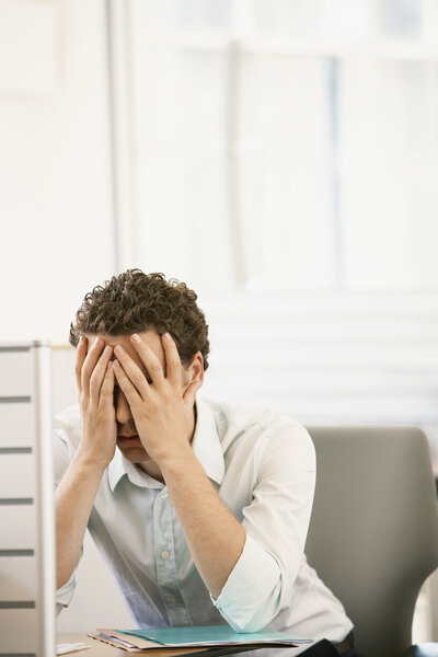 Office worker sitting in cubicle