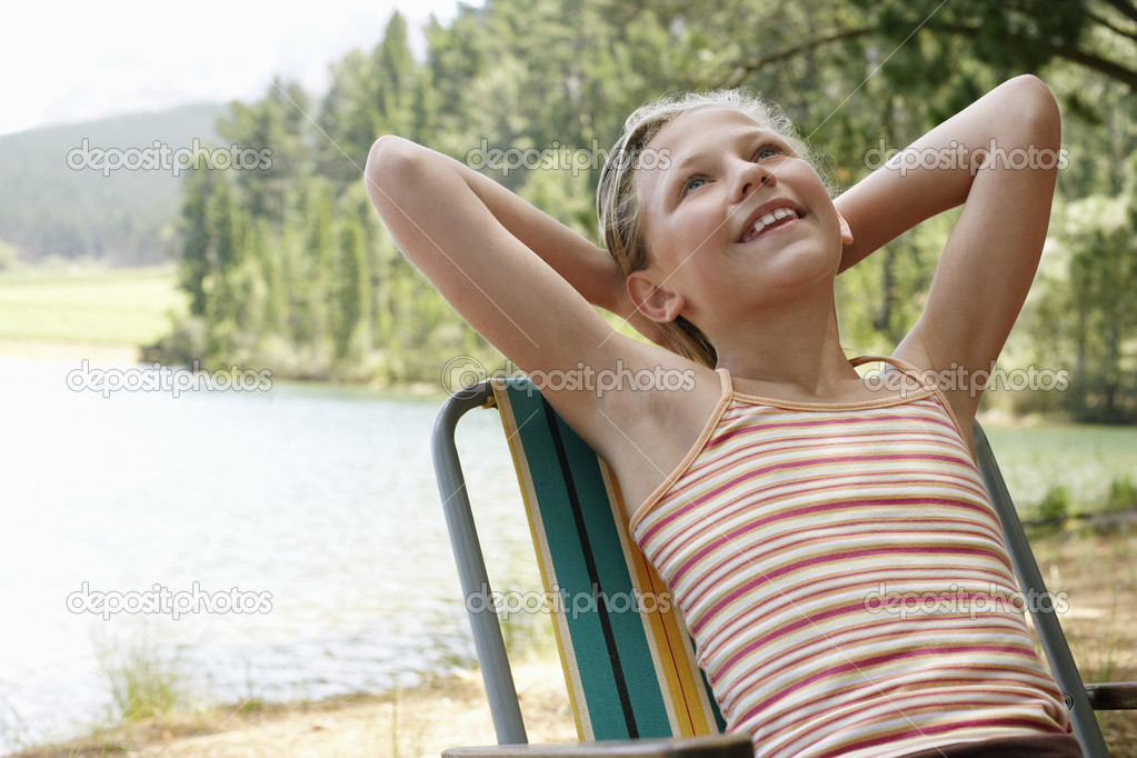 Girl Relaxing at deck chair 