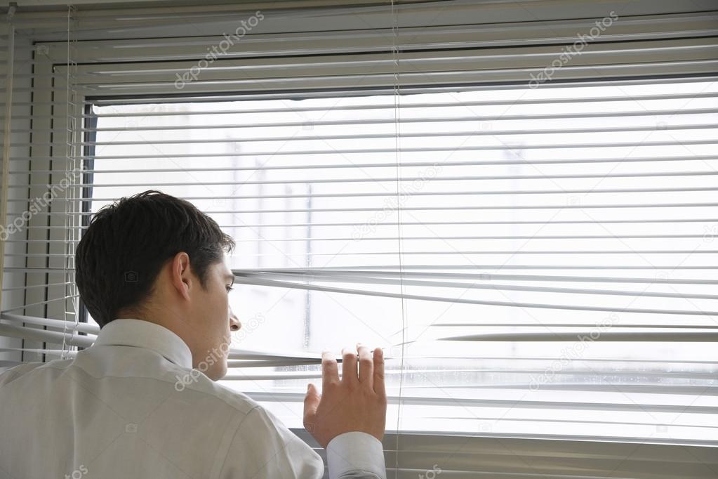 Businessman Looking out office Window