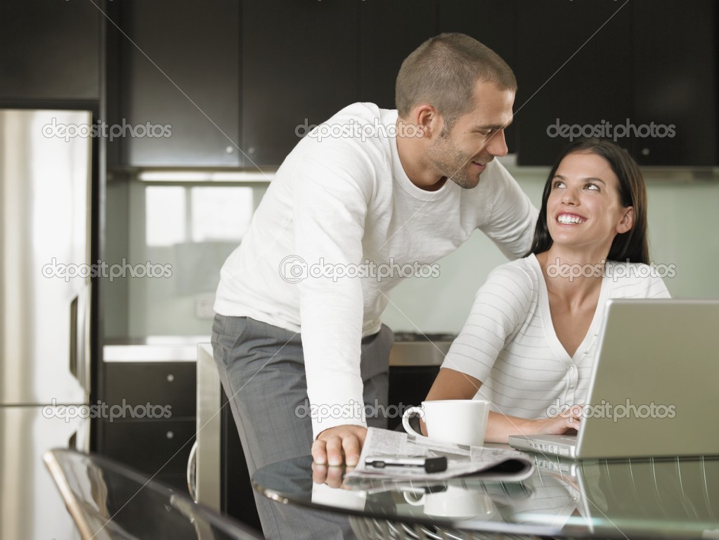 Young Couple Using Laptop