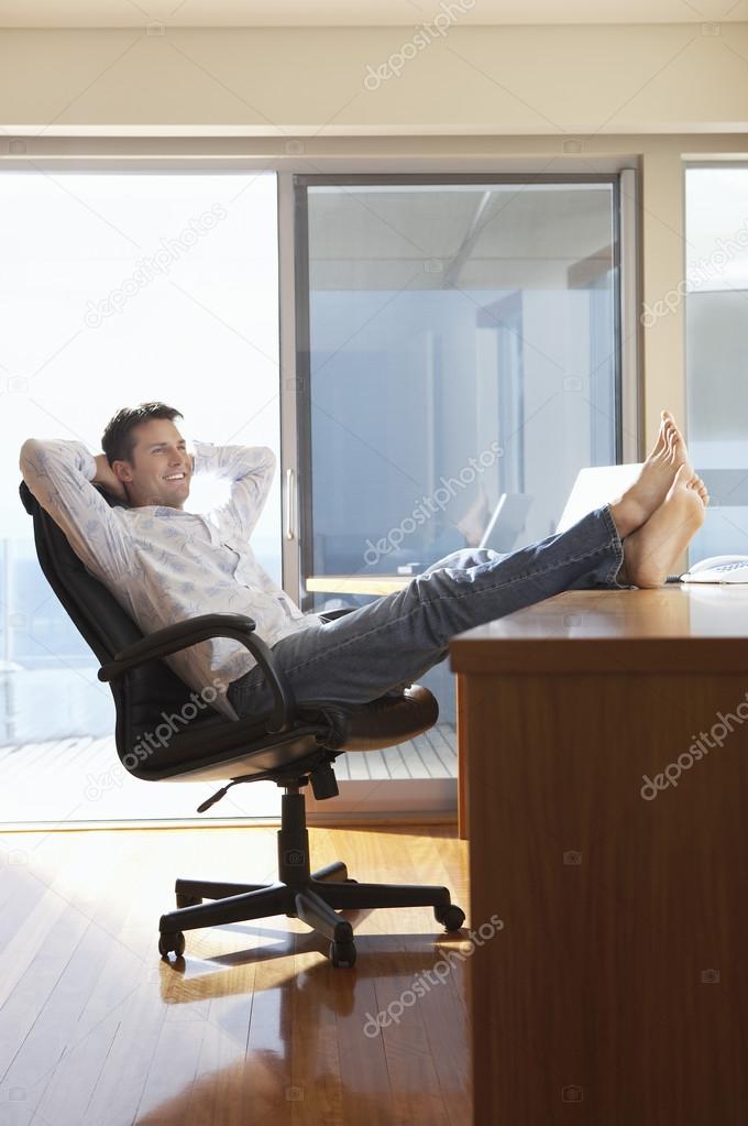 Man Relaxing with Feat Up