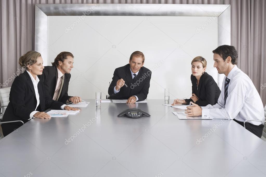 Businesspeople Listening During Teleconference