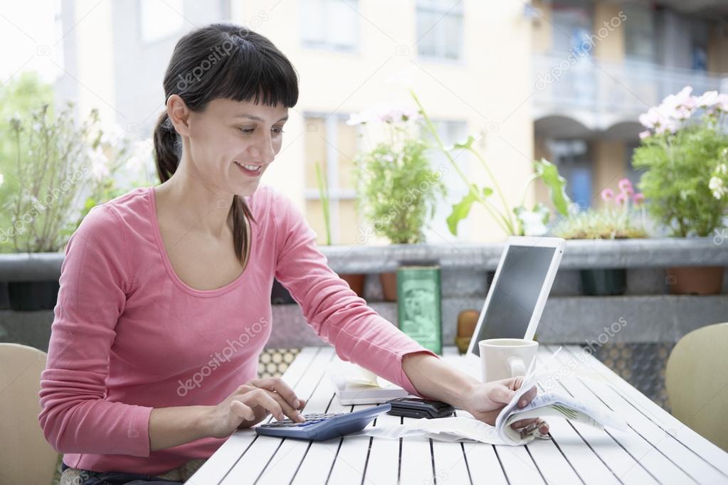 Businesswoman calculating