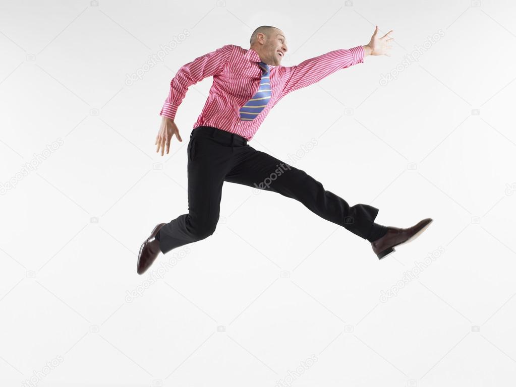 Businessman jumping