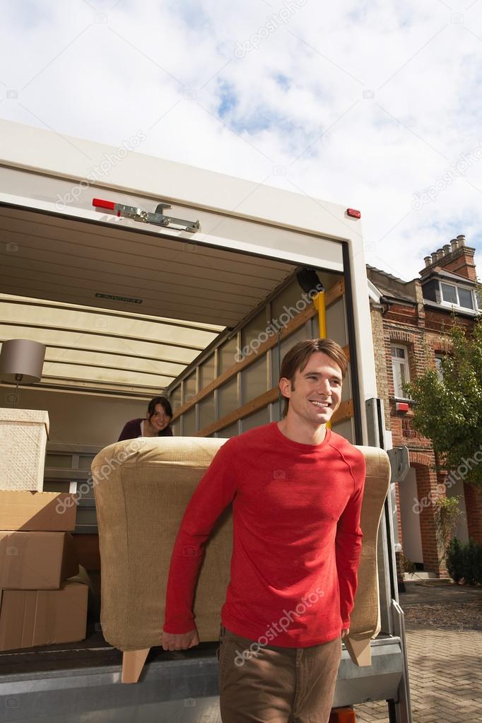 Moving Couple Carrying Sofa