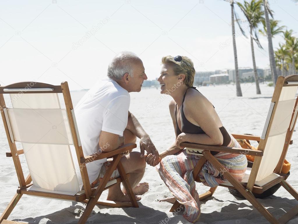 Couple on sunloungers