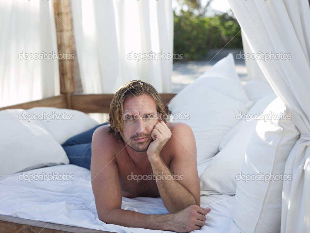 Man lying down on bed