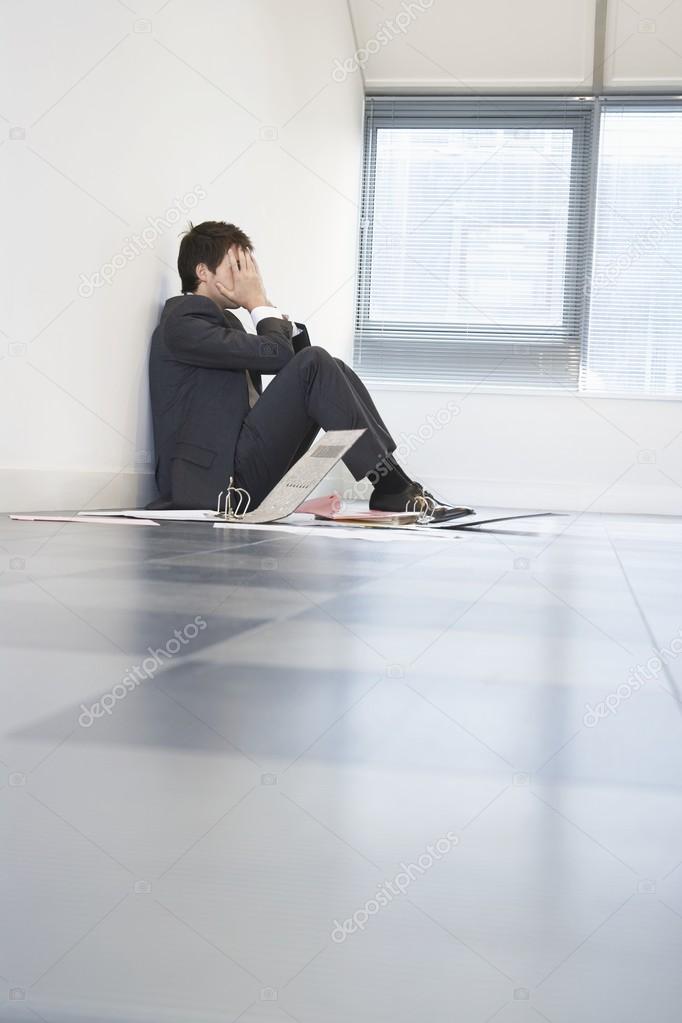 Despaired Businessman Sitting on Floor
