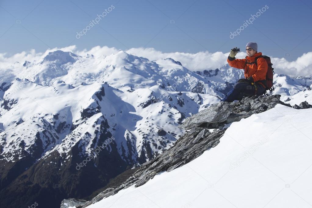 Mountain climber taking picture
