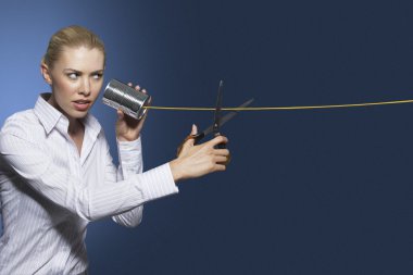 Woman cutting line on tin can string phone clipart
