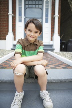 Boy With Bandaid on Knee clipart