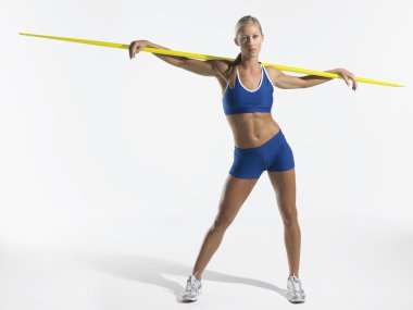 Female athlete holding javelin clipart