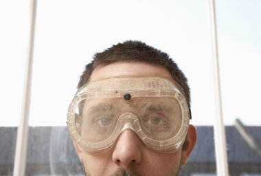 Man Wearing Protective Eye Goggles clipart
