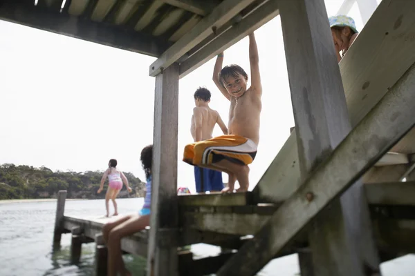 Barefoot Children on wooden jetty — Stock Photo, Image