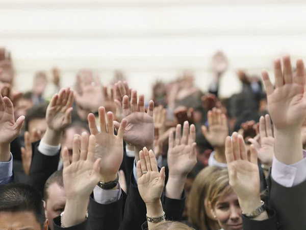 Crowd of people raising hands — Stock Photo, Image