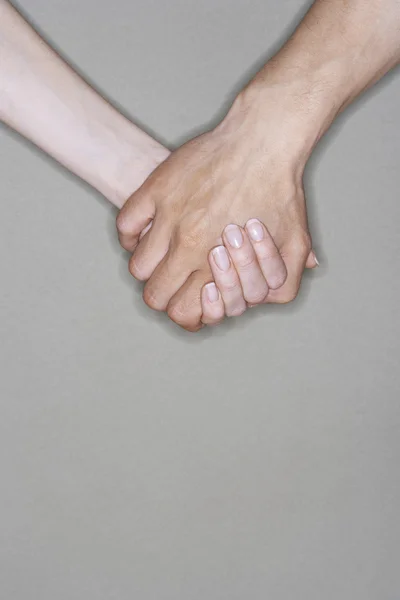 Man en vrouw hand in hand — Stockfoto