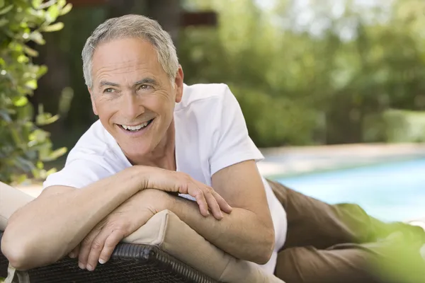 Man reclining on chair — Stock Photo, Image