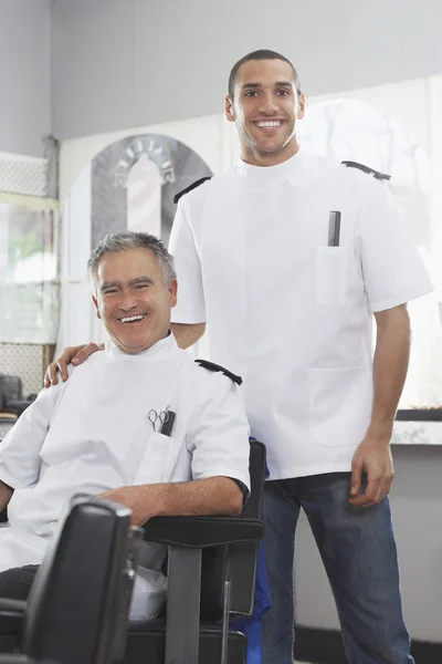 Two barbers in barber shop — Stock Photo, Image