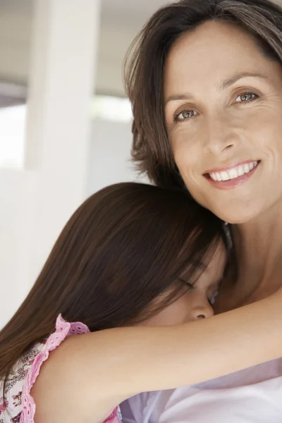 Mother cuddling  daughter — Stock Photo, Image