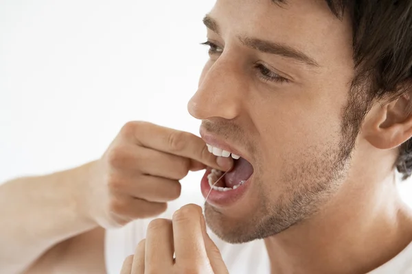 Man flossing teeth Stock Picture