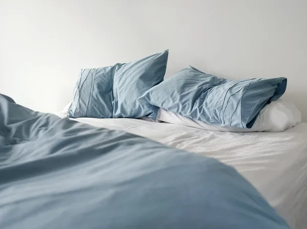 Unmade empty bed Stock Picture