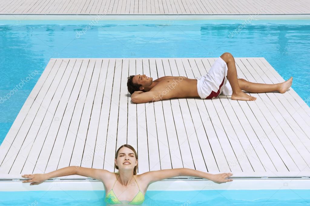 Couple Relaxing at Swimming Pool