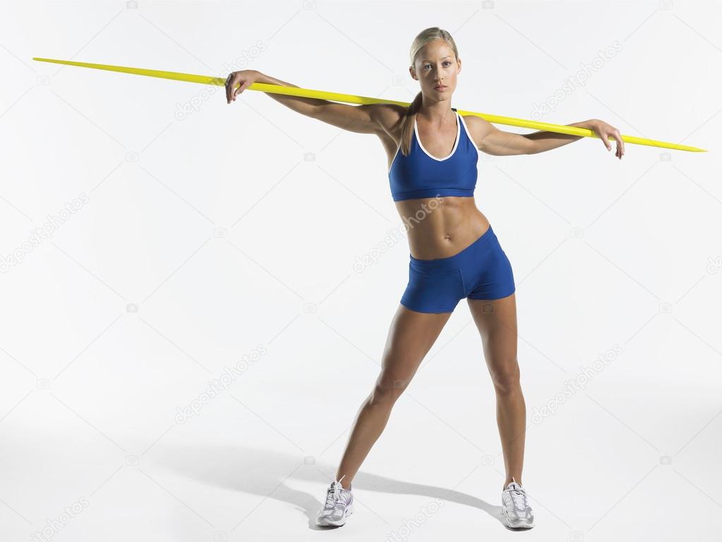 Female athlete holding javelin