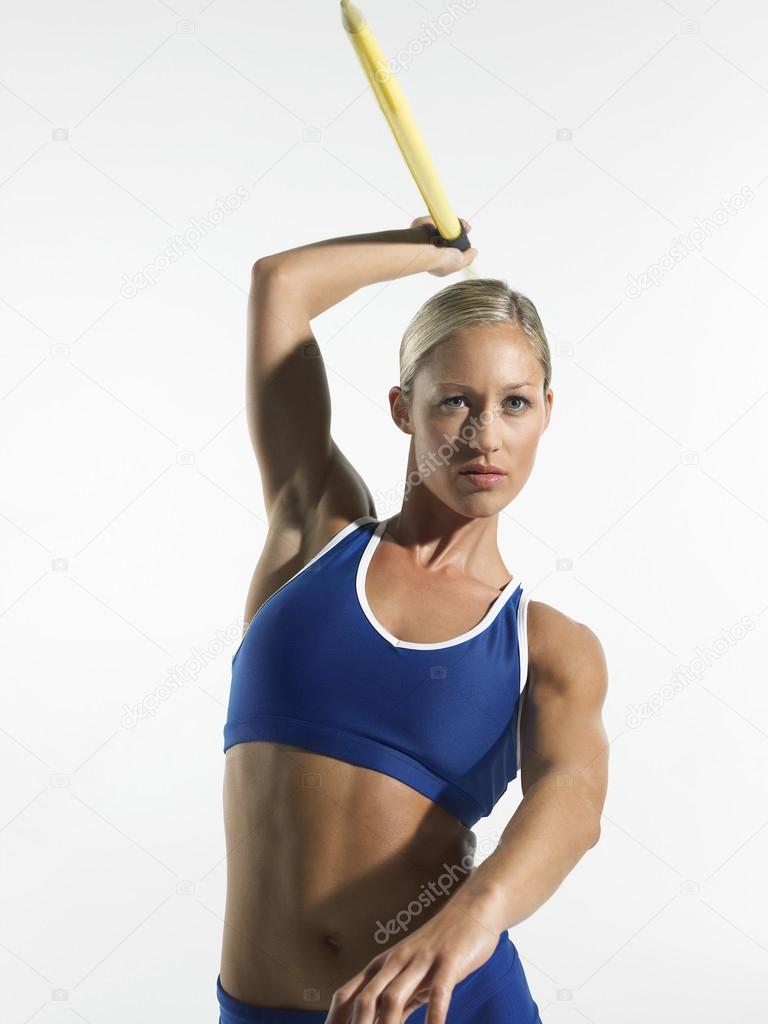 Female athlete throw javelin