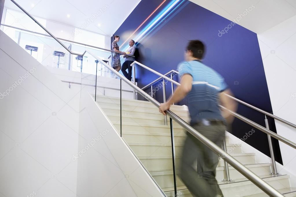 Businessman Walking Up Stairs