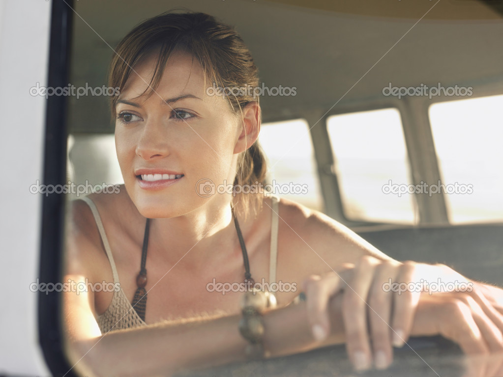 Woman sitting in van