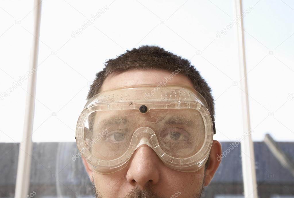 Man Wearing Protective Eye Goggles