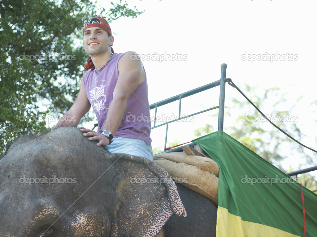 Man riding elephant