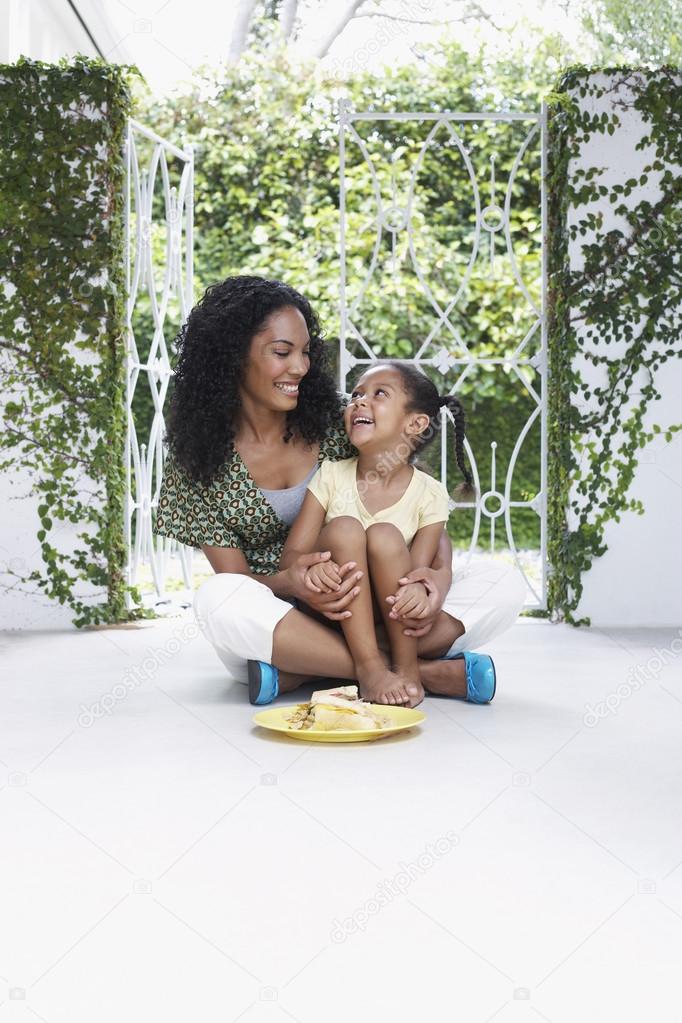 Mother and daughter  sitting