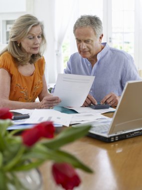 Couple looking at bills